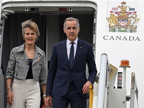 A scramble for phones, an unfolding war in Iran and a personal day for Prime Minister Mark Carney